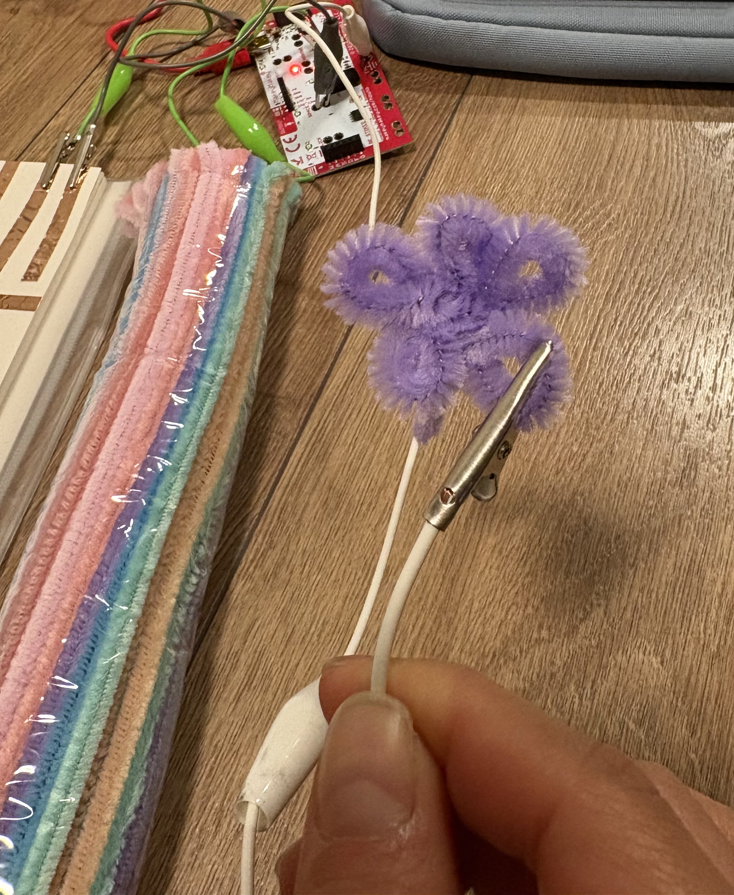 I made a tiny flower to use as the trigger, the code activates when the windpiper touches the copper tape.
